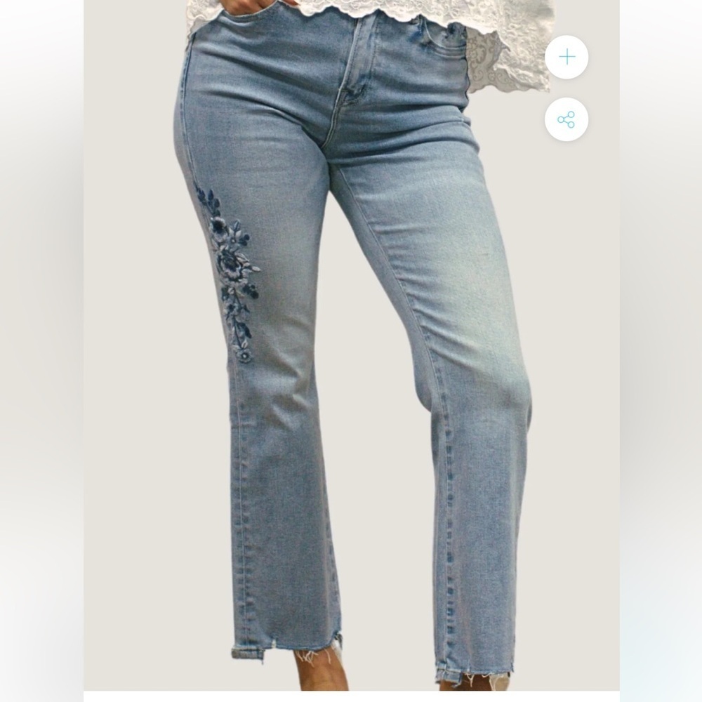 NWT Karyn Seo light-wash denim flare jeans with blue floral embroidery  raw hem.